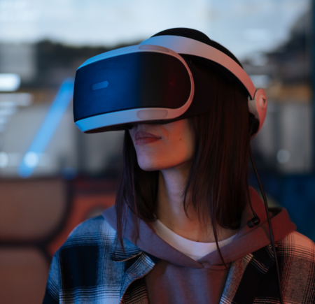Young woman wearing VR headset for gaming